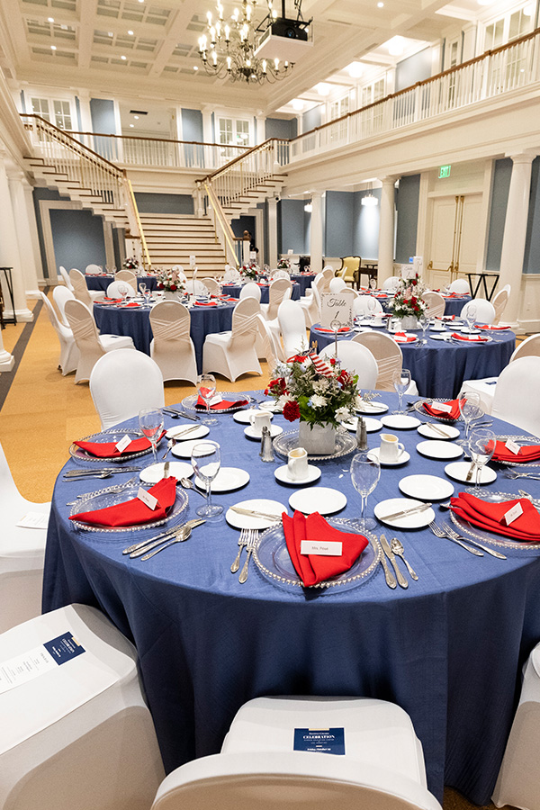 A view of set tables in function room at the Searle Center.