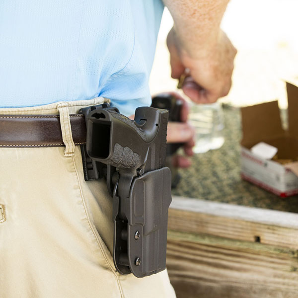 A close-up image of a pistoled that is holstered.