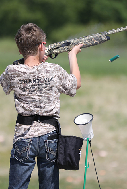 A youth competes in high school trap championships